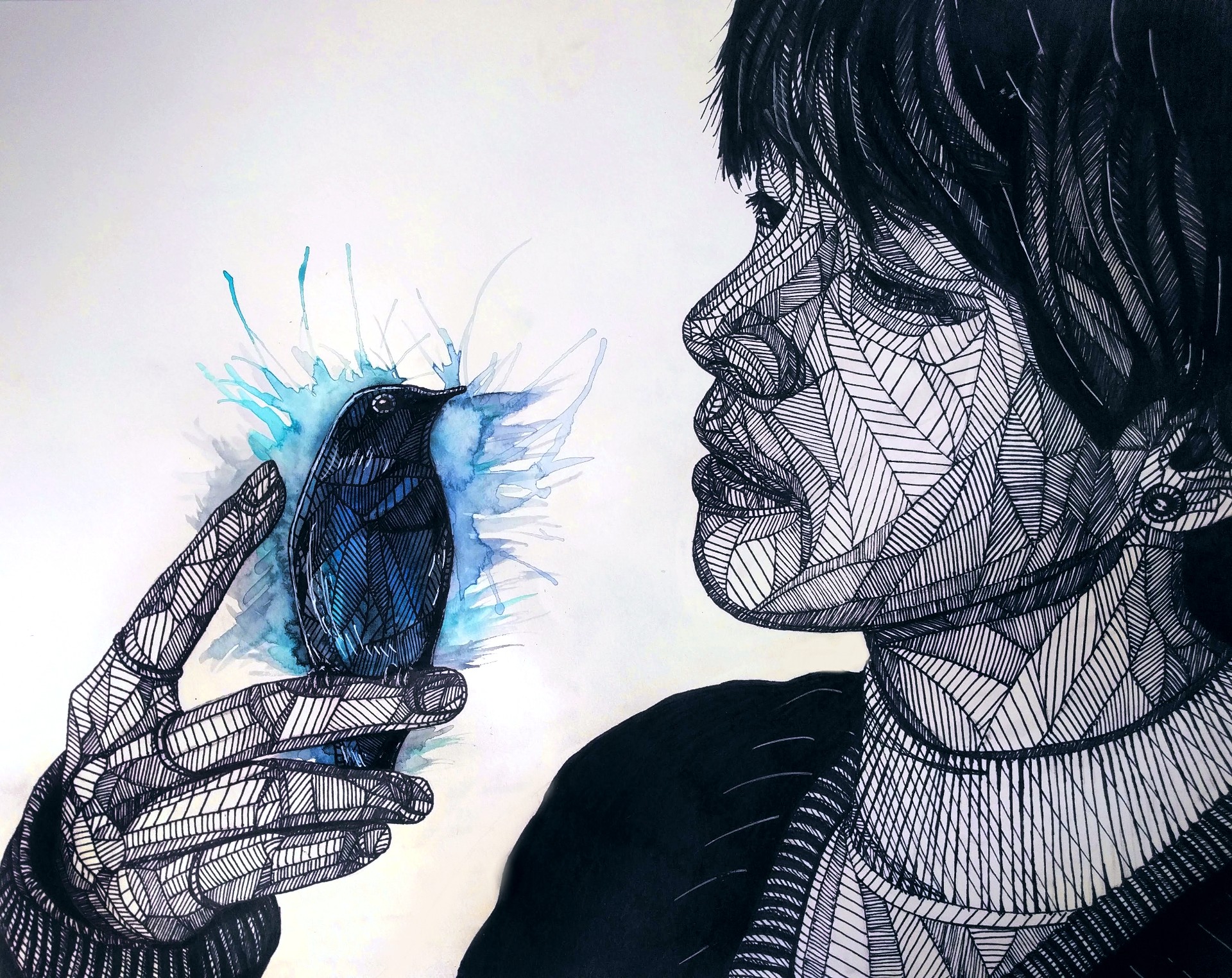 A person looks at a bird they hold in their hand